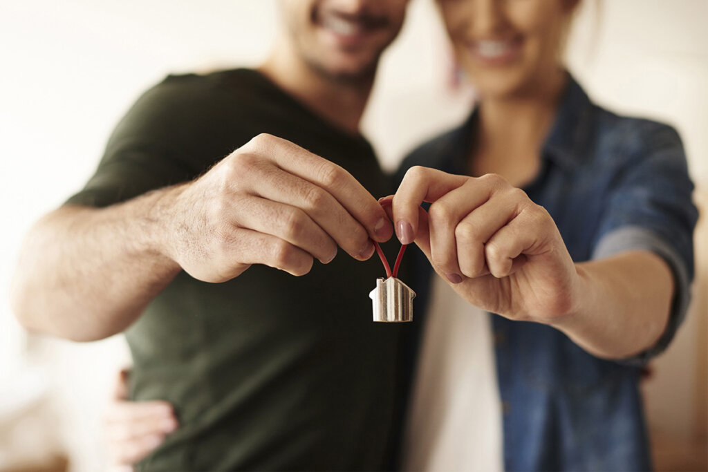 Couple holding house key